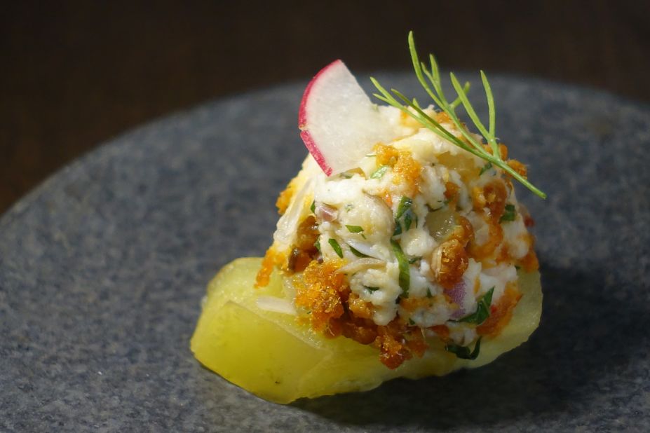Candlenut's smashed prawn with sambal hae bi (spicy dried shrimps) over starfruit with dill. 