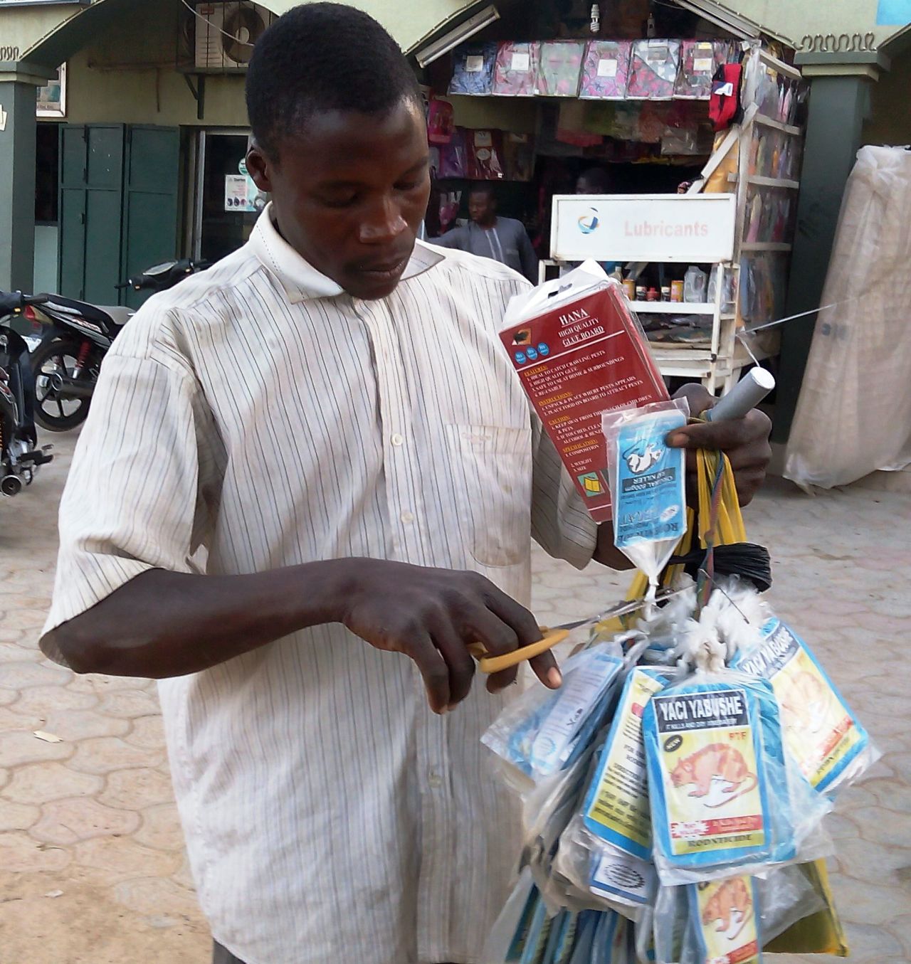 Sales of rat poison, as a means of preventing infection, have taken off in Nigeria following the outbreak of Lassa fever. Pictured, a vendor sells bags of rat poison in northern Nigeria's largest city of Kano.