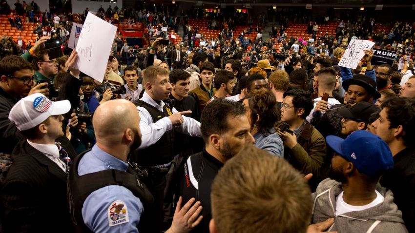 Anti-Donald Trump protesters confront with his supporters during a Trump rally at the UIC Pavilion in Chicago on March 11, 2016.