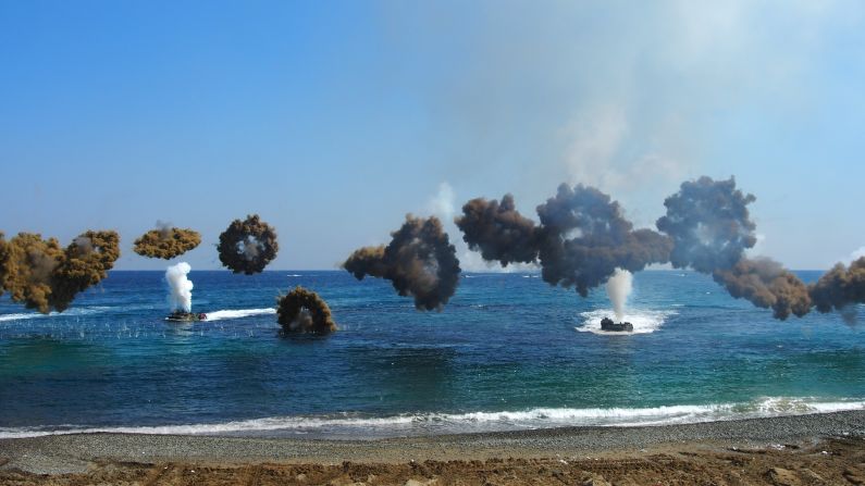 Clouds of camouflage smoke obscure amphibious assault vehicles coming into shore as part of military exercises on March 12.  South Korea's defense ministry spokesman is calling the maneuvers "the largest scale ever," involving 300,000 South Korean soldiers and at least 17,000 from the U.S.