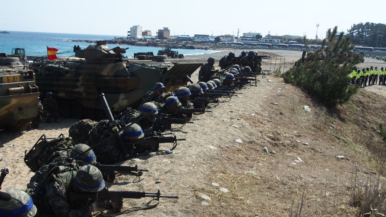 South Korean Marines points their weapons during the joint military exercises held on March 12.
