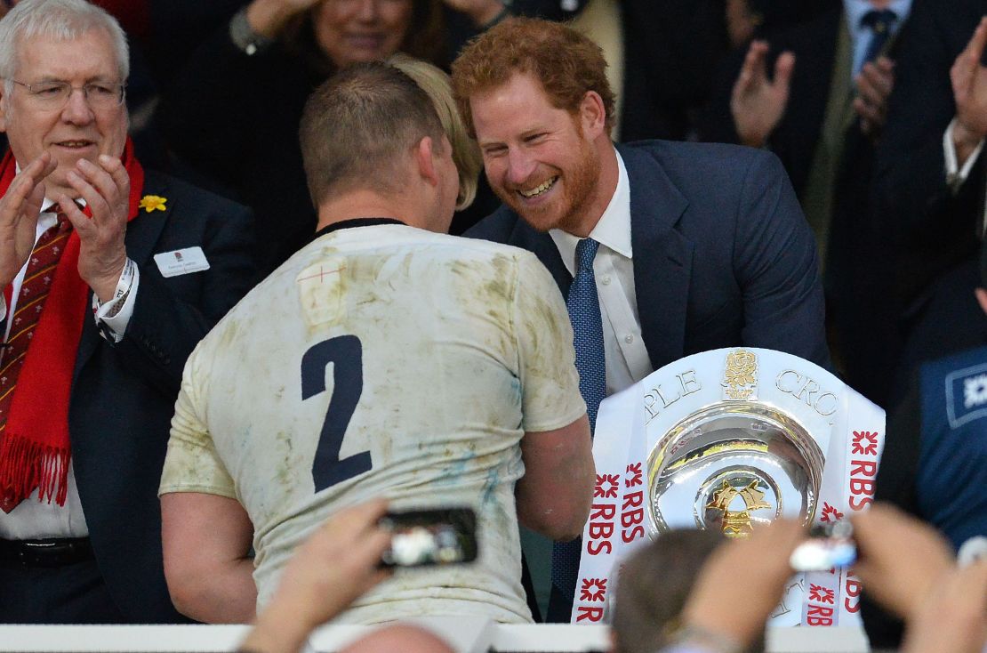 England captain Dylan Hartley received the trophy from Prince Harry.