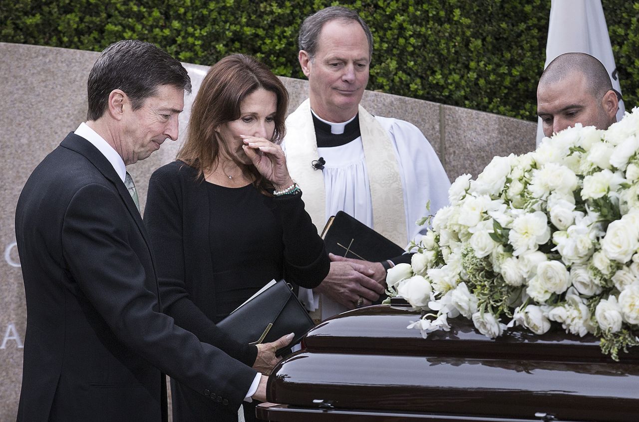 Ron Reagan and sister Patti Davis pause at the casket of their mother, Nancy Reagan, at her gravesite at the Ronald Reagan Presidential Library in Simi Valley, California, on Friday, March 11. <a href="http://www.cnn.com/2016/03/11/politics/gallery/nancy-reagan-funeral/index.html" target="_blank">Funeral services for the former first lady </a>were held at the library Friday.