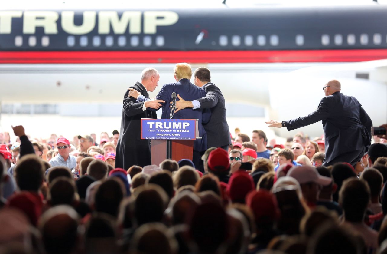 Republican presidential candidate Donald Trump is escorted off the stage by Secret Service agents after a man<a href="http://www.cnn.com/2016/03/12/politics/donald-trump-protests/index.html" target="_blank"> jumped a barrier and tried to rush the stage</a> during a campaign rally at Dayton International Airport in Ohio on Saturday, March 12.