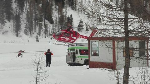 A rescue helicopter takes off in Valle Aurina in the Italian Alps to try to reach Monto Nevoso where at least six skiers have died in an avalanche Saturday, March 12, 2016.