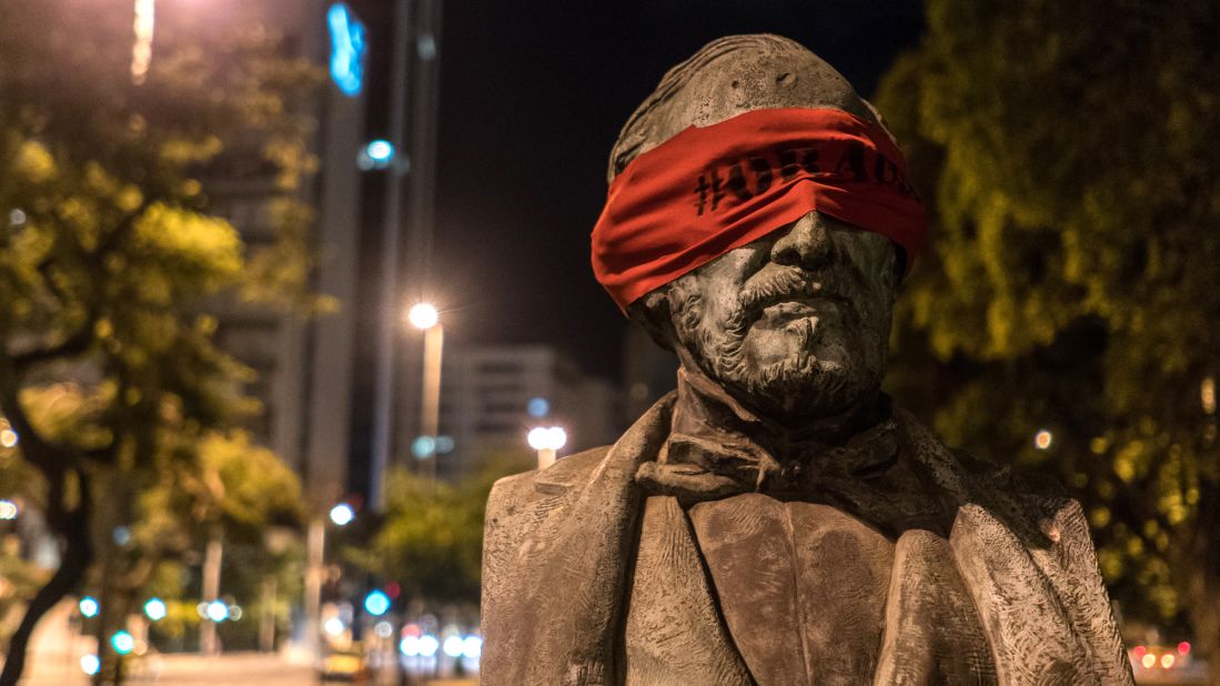 An anonymous artist in Brazil has blindfolded statues across the city of Rio de Janeiro in an effort to silently and peacefully protest the country's growing corruption problem.