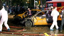 Forensic services and firemen work around burnt out taxi vehicles after a blast in Ankara on March 13, 2016.
An explosion ripped through a busy square in central Ankara on March 13, killing 25 people and wounding 75 more, with local media reports describing it as an attack. Ambulances rushed to the scene of the explosion on Kizilay square, a key shopping and transport hub close to the city's embassy area.
 / AFP / ADEM ALTAN        (Photo credit should read ADEM ALTAN/AFP/Getty Images)