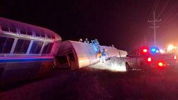 Emergency personnel work on a train that derailed near Dodge City, Kan., Monday, March 14, 2016. An Amtrak statement says the train was traveling from Los Angeles to Chicago early Monday when it derailed just after midnight. (Daniel Szczerba via AP) MANDATORY CREDIT