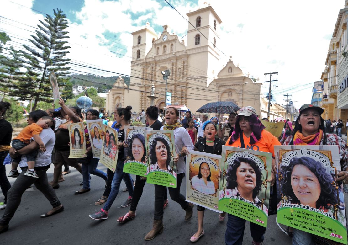 Protesters hold pictures of Berta Caceres at an International Women's day demonstration in Tegucigalpa on March 8.