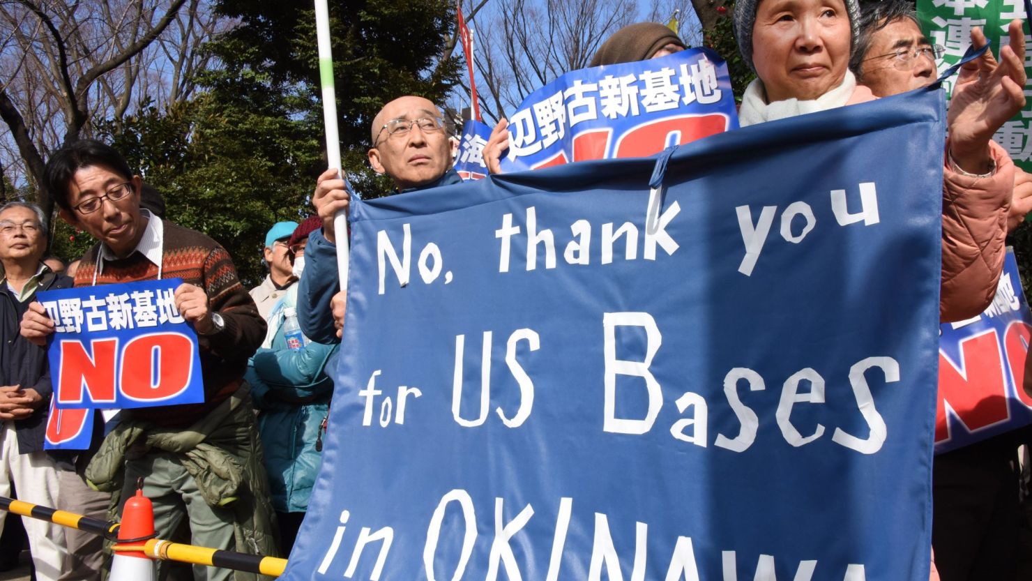 Demonstrators protest the construction of a U.S. Marine air base in the remote Henoko part of Okinawa island, to replace the existing Futenma facility, in front of the National Diet in Tokyo on February 21, 2016. 