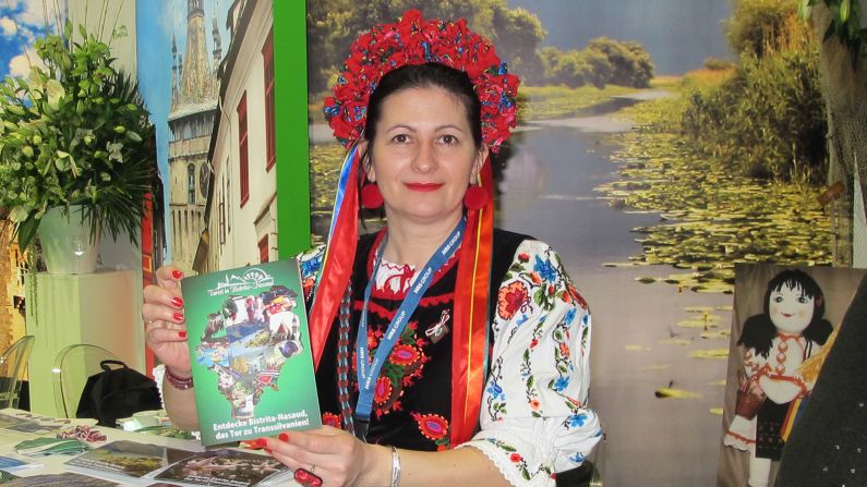 Romania was working overtime at ITB, with roving men in straw hats, musicians, potters, food and this woman in a charming bonnet.