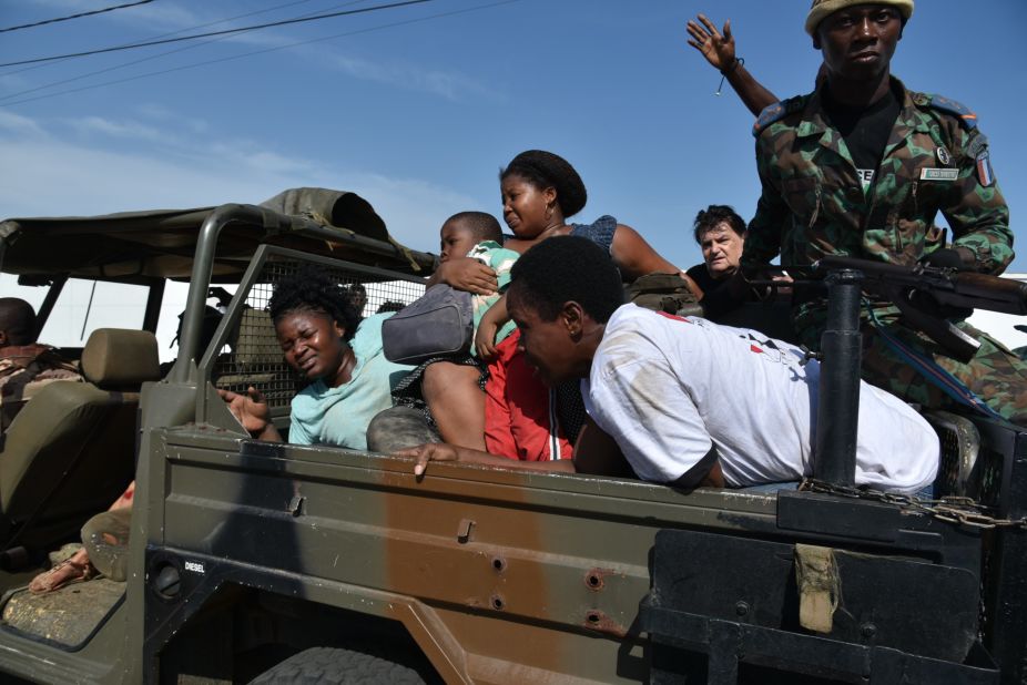 Ivorian forces transport civilians to safety.