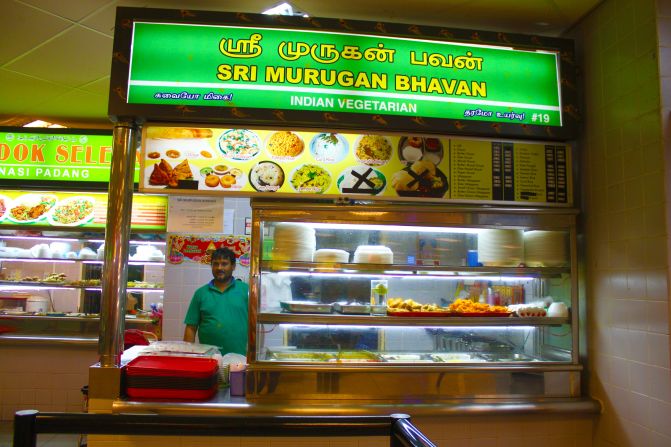 The Sri Murugan Bhavan stall sells vegetarian Indian food on trays covered in baking paper.