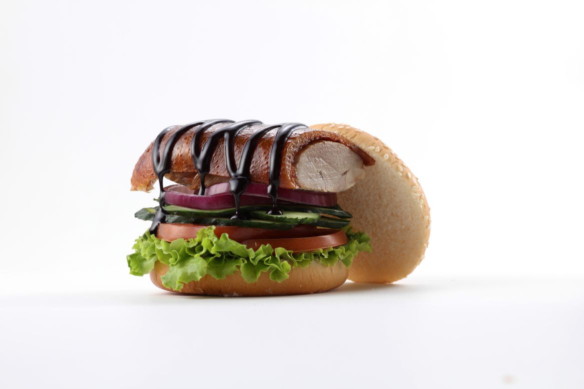 DaDong's signature Peking duck burger costs 22 yuan ($3.40). Diners can choose whether they want it topped with traditional plum or spicy sauce. 