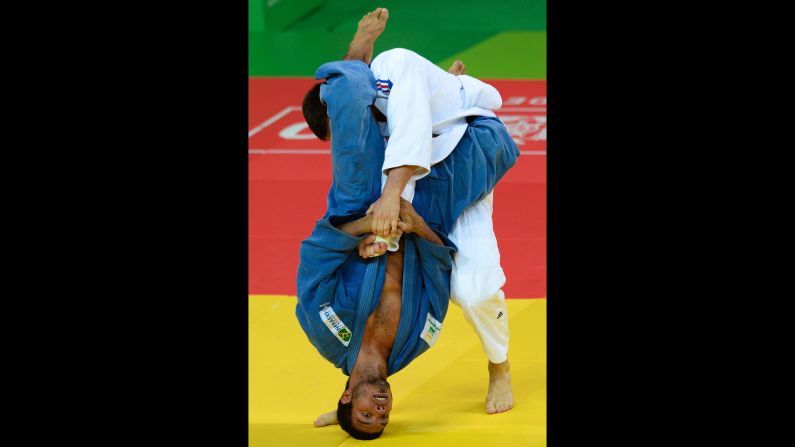 Nicolas Chilard, on top, of France fights with Igor Pereira of Brazil during the International Judo Tournament at the Olympic Park on Wednesday, March 9, in Rio de Janeiro. 