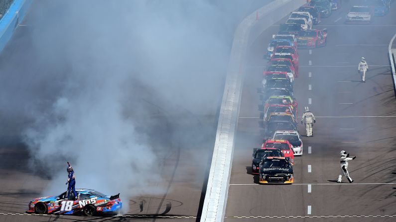 Kyle Busch, driver of No. 18, celebrates with a burnout after winning the NASCAR Xfinity Series at Phoenix International Raceway on Saturday, March 12, in Avondale, Arizona. 