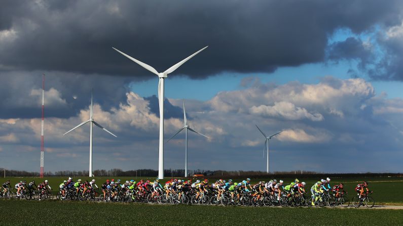 The peloton passes a wind farm on stage four of the 2016 Paris-Nice on Thursday, March 10, in Romans-sur-Isere, France. 