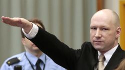 Norwegian mass killer Anders Behring Breivik makes a Nazi salute as he enters the court room in Skien prison for his lawsuit against the Norwegian state.