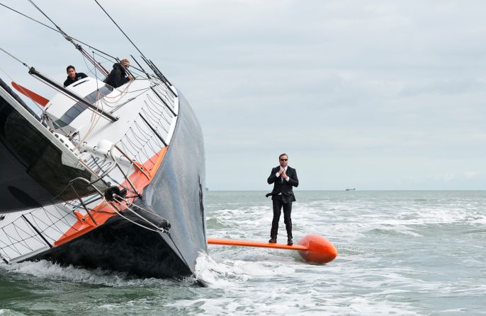For the first stunt, Thomson strolled along the keel of his speeding race yacht.