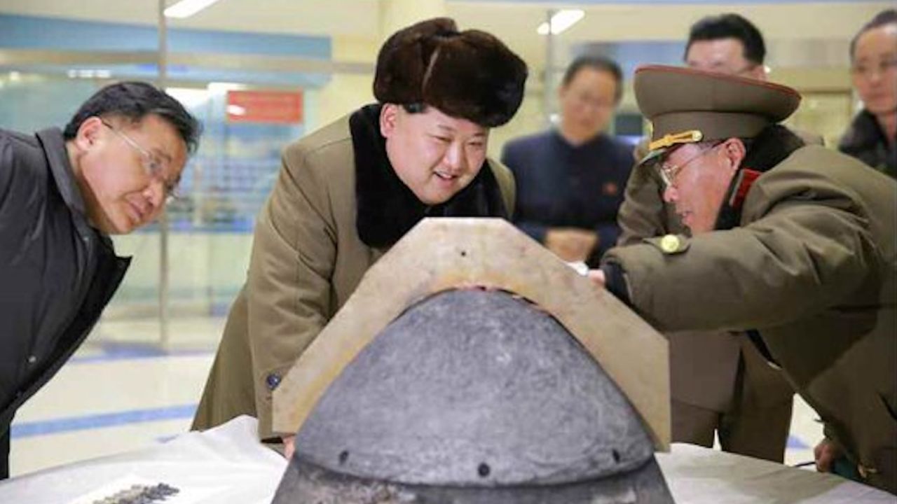 North Korean leader Kim Jung-un reviewing a ballistic rocket simulation.