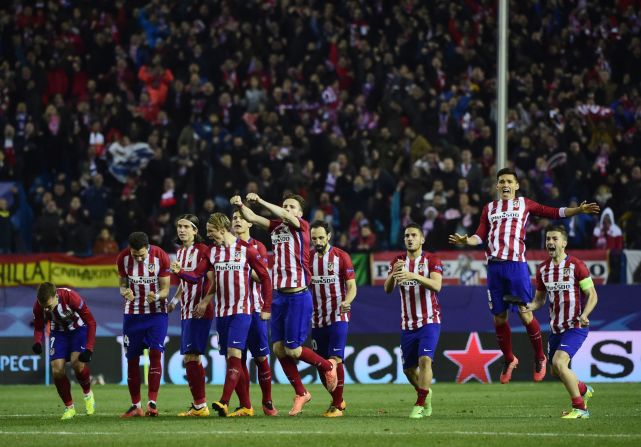 Atletico de Madrid players celebrate their passage after a remarkable shootout in which they scored all eight of their penalties. 