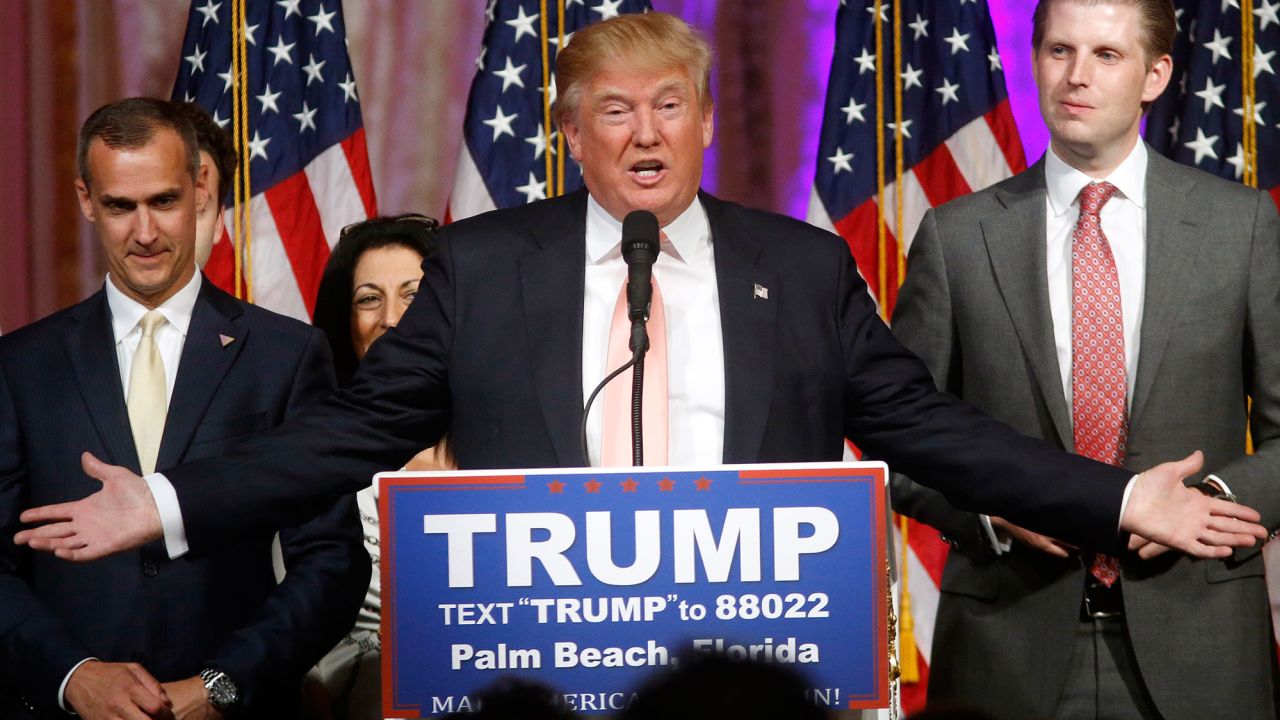 Republican presidential candidate Donald Trump speaks to supporters at his primary election night event at his Mar-a-Lago Club in Palm Beach, Fla., Tuesday, March 15, 2016. At right is his son Eric Trump and at left is campaign manager Corey Lewandowski. (AP Photo/Gerald Herbert)