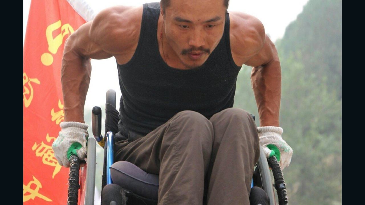 Quan has wheeled himself from Beijing to Fuzhou and has the muscles to prove it. 