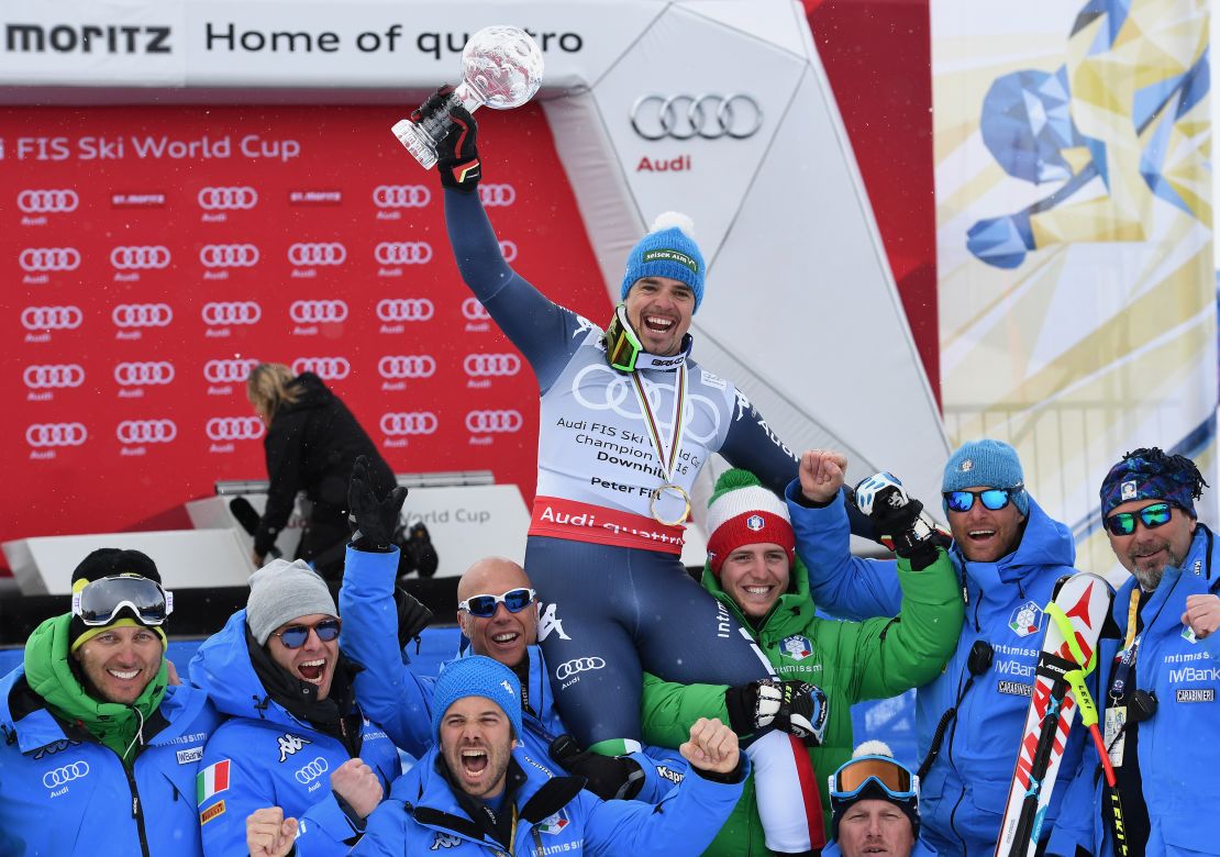 The Italian team celebrate Fill's World Cup downhill Crystal Globe.