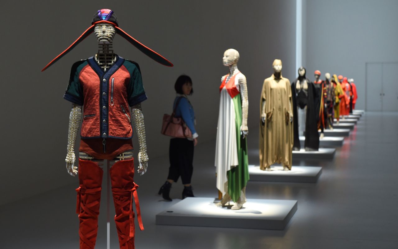 Creations by Issey Miyake line a wall at the Miyake Issey Exhibition in Tokyo. 