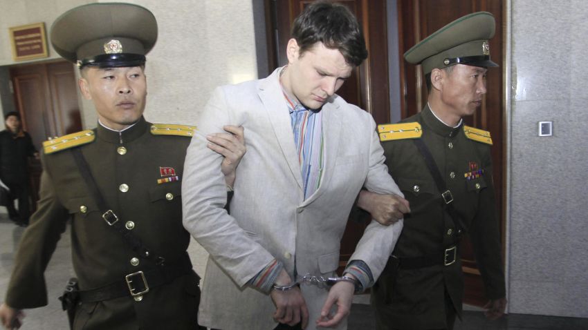 American student Otto Warmbier is escorted at the Supreme Court Wednesday, March 16, 2016, in Pyongyang, North Korea. North Korea's highest court sentenced Warmbier, a 21-year-old University of Virginia undergraduate student, from Wyoming, Ohio, to 15 years in prison with hard labor on Wednesday for subversion. He allegedly attempted to steal a propaganda banner from a restricted area of his hotel at the request of an acquaintance who wanted to hang it in her church. (AP Photo/Jon Chol Jin)