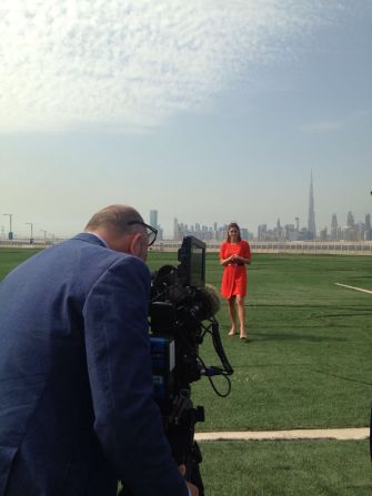 Filming links in Dubai with the city's stunning skyline as a backdrop.