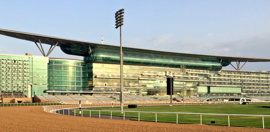The majestic Meydan racecourse at sunrise -- the coolest time of day for the horses to work on the track.