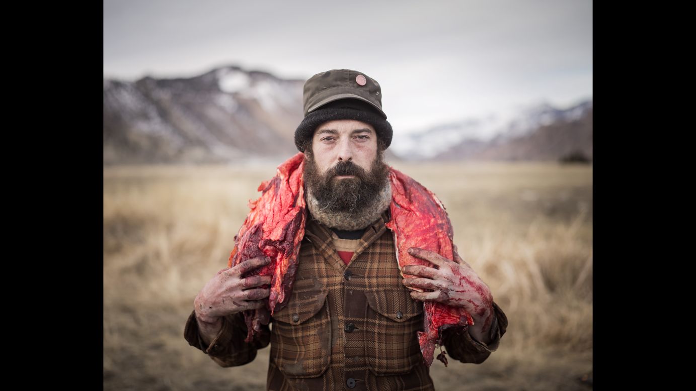 Josh carries a buffalo backstrap from the hunting ground. 