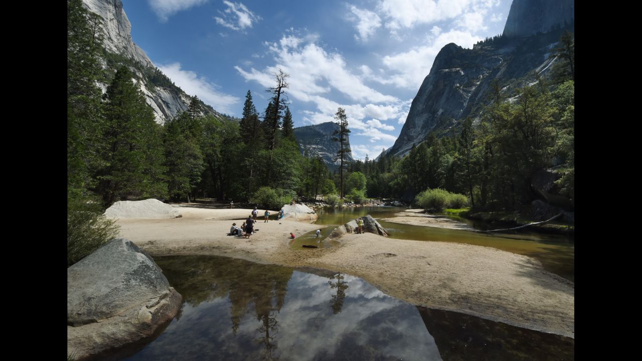 People picnic in July on the sandy bottom of Mirror Lake, which is normally covered with water at Yosemite National Park.