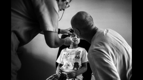 Alex undergoes an eye exam at a hospital in Trieste, Italy. Alex has an ulcerated cornea and suffers from photophobia, meaning that he is incredibly sensitive to light and it can have a painful, blinding effect on him. He's already losing his eyesight.