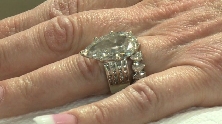 MO:12 Carat Diamond Ring Lost and Found in 8 Tons of garbage    **This package/segment contains third party material. Unless otherwise noted, this material may only be used within this package/segment. Usage must cease on all platforms (including digital) within ten days of its initial delivery or such shorter time as designated by CNN.    CLARKSON VALLEY, MO (KTVI) It was the case of missing wedding rings, two rings lost in 8 tons of trash.    One of them with a 12 and a half carat diamond and the Squitieri's of Clarkson Valley had to get dirty, stinky and lucky to get them back.    It started in the Squitieri family kitchen Sunday afternoon.  Sunday night her husband was cleaning up around the sink and early Monday morning the Meridian Waste truck picked up the garbage.    Carla Squitieri`s rings were mixed in with the garbage of more than 900 customers.    After a few prayers and phone calls the Squitieri`s realized her rings were in the garbage.  Minutes before they hit the landfill, Meridian diverted their truck to a transfer station and the dig was on.    Joe Evans of Meridian Waste ended up finding the rings.    The rings are insured, but it's the sentimental value that had the Squitieri's digging through rotted food and dirty diapers.  Meridian workers know all about that and say they'd do this for anybody.