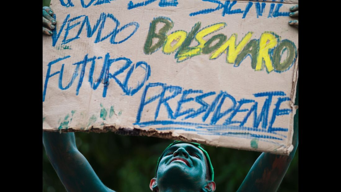 A painted man in Manaus, Brazil, holds a placard supporting Congressman Jair Bolsonaro for President on March 13.