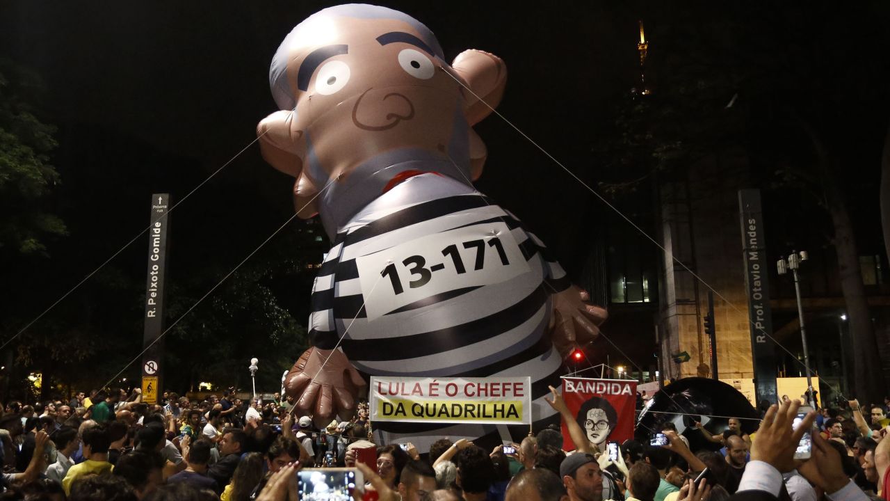 Demonstrators in Sao Paul carry a balloon depicting Lula da Silva as a convict on March 16.