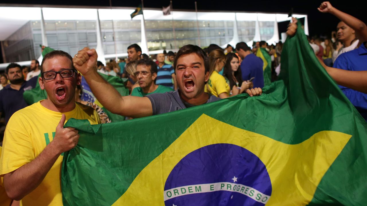 Demonstrators call for Rousseff's resignation outside the presidential palace in Brasilia on Wednesday, March 16.