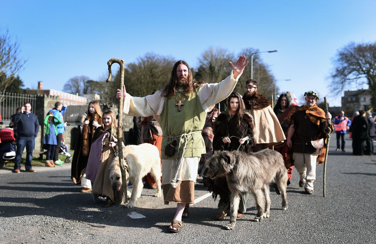 Participants dressed as St. Patrick and his followers lead the annual parade in Downpatrick, Northern Ireland.
