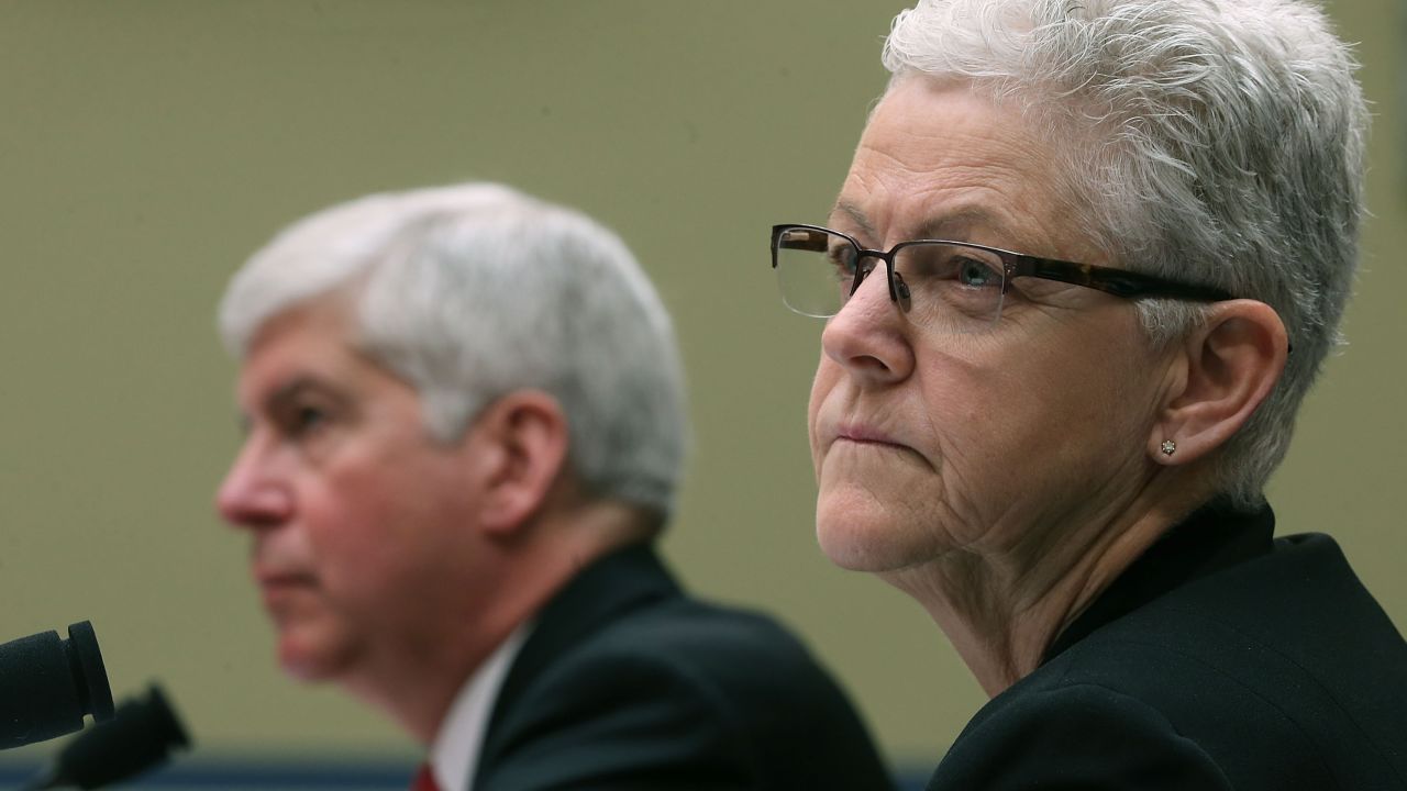 EPA Administrator Gina McCarthy, (R), and Gov. Rick Snyder, (R-MI), listen to members comments during a House Oversight and Government Reform Committee hearing, about the Flint, Michigan water crisis, on Capitol Hill March 17, 2016 in Washington, DC.