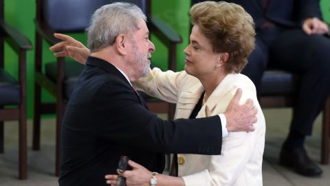 Former Brazilian president Luiz Inacio Lula da Silva (L) hugs Brazilian president Dilma Rousseff. 