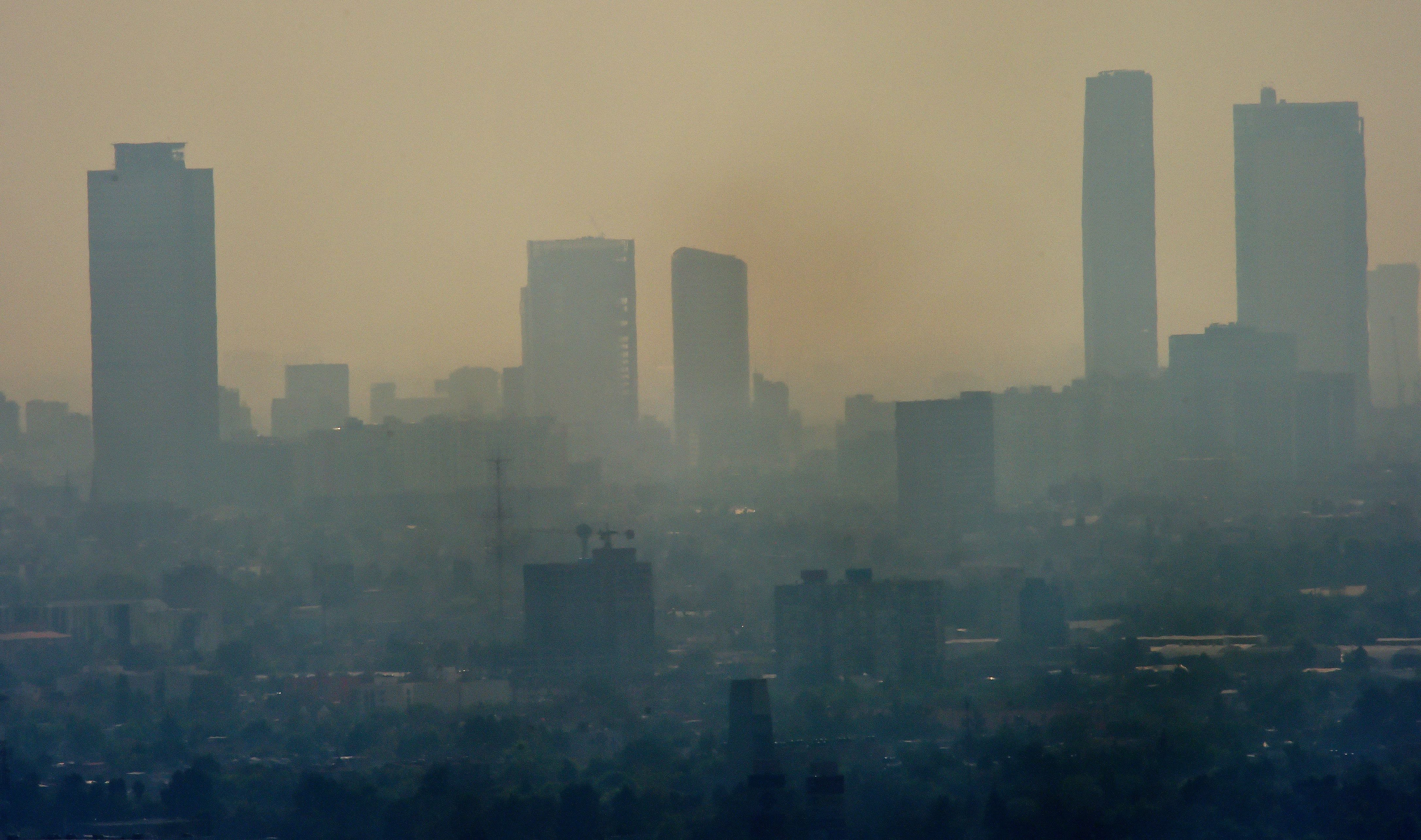 Smog envelopes skyscrapers in Mexico City in December 2015. It was considered the most polluted city in the world during the 1990s and its problems today, as this picture shows, are far from over.