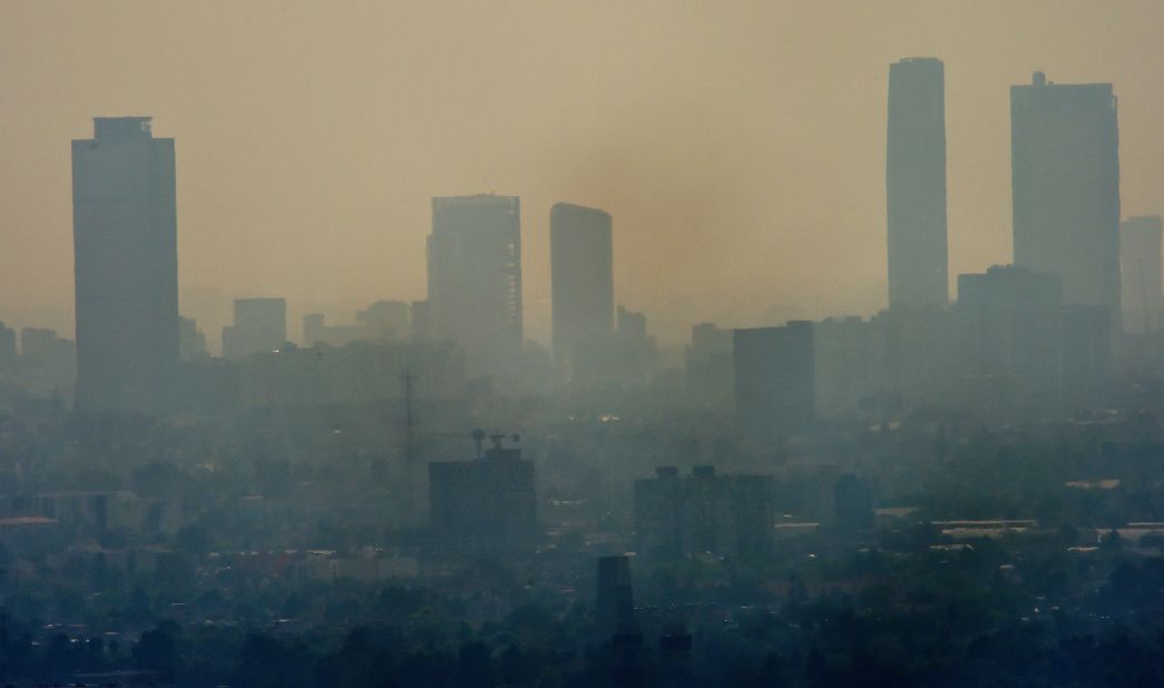 Smog envelopes skyscrapers in Mexico City in December 2015. It was considered the most polluted city in the world during the 1990s and its problems today, as this picture shows, are far from over. 