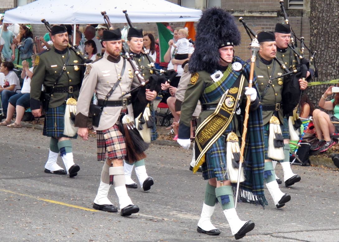 Members of the U.S Customs and Border Patrol Pipes and Drums band march in the St. Patrick's Day parade in Savannah, Georgia.