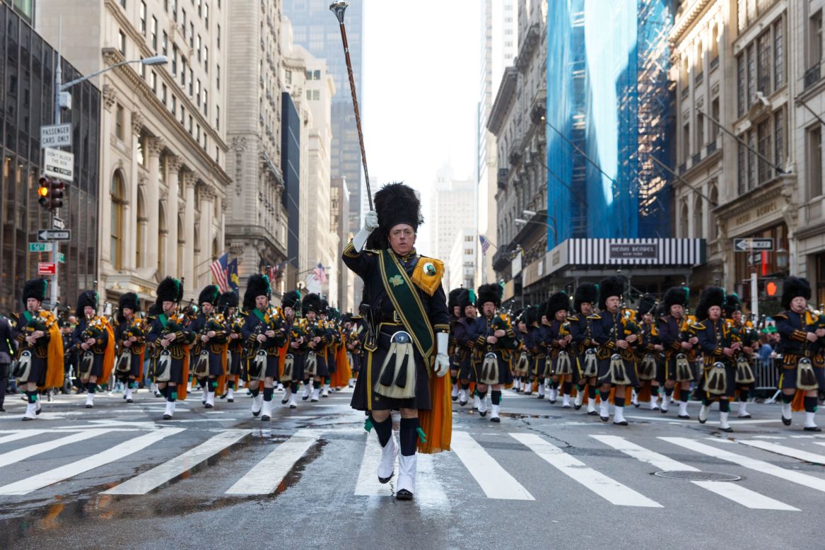 Participants perform as they march up the Fifth Avenue during the 255th St. Patrick's Day Parade in New York.