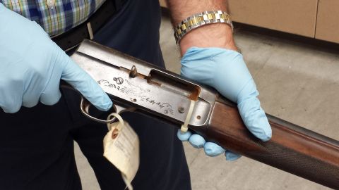 Seattle Police Detective Mike Ciesynski holds shotgun used in Kurt Cobain suicide 