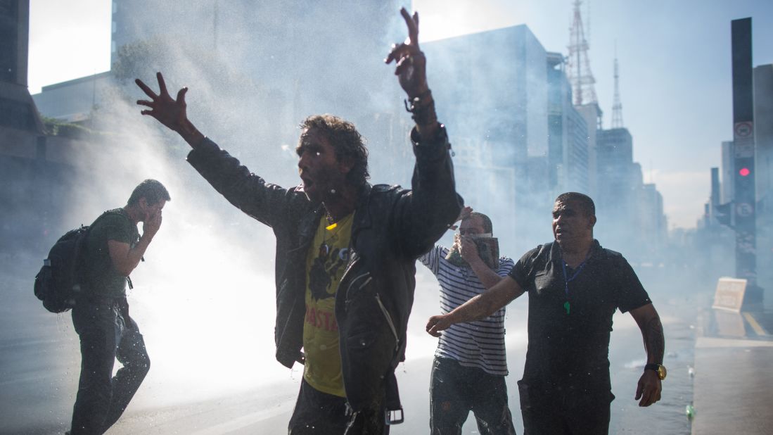 Police use water cannons on Sao Paulo protesters on March 18. Many Brazilians are also frustrated <a href="http://money.cnn.com/2016/03/17/news/economy/brazil-rousseff-lula-economy/" target="_blank">with a spiraling economy.</a>