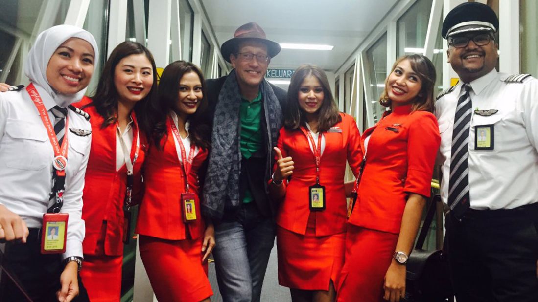 Quest poses with the AirAsia flight crew after flying from Sri Lanka to Malaysia. 