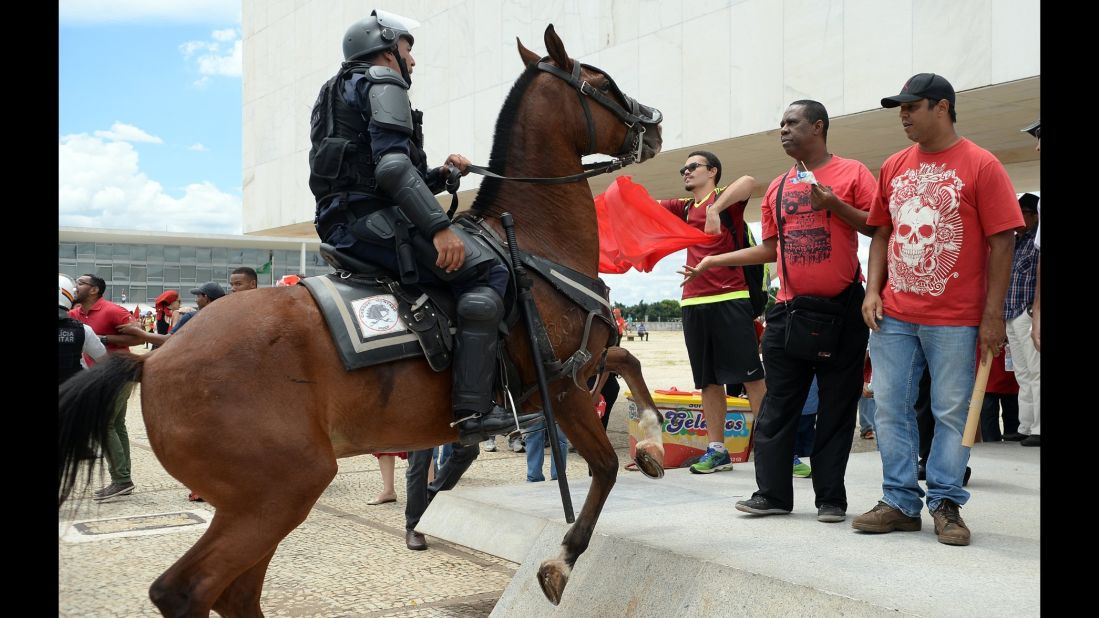 Demonstrators gather next to the presidential palace in Brasilia on Thursday, March 17.